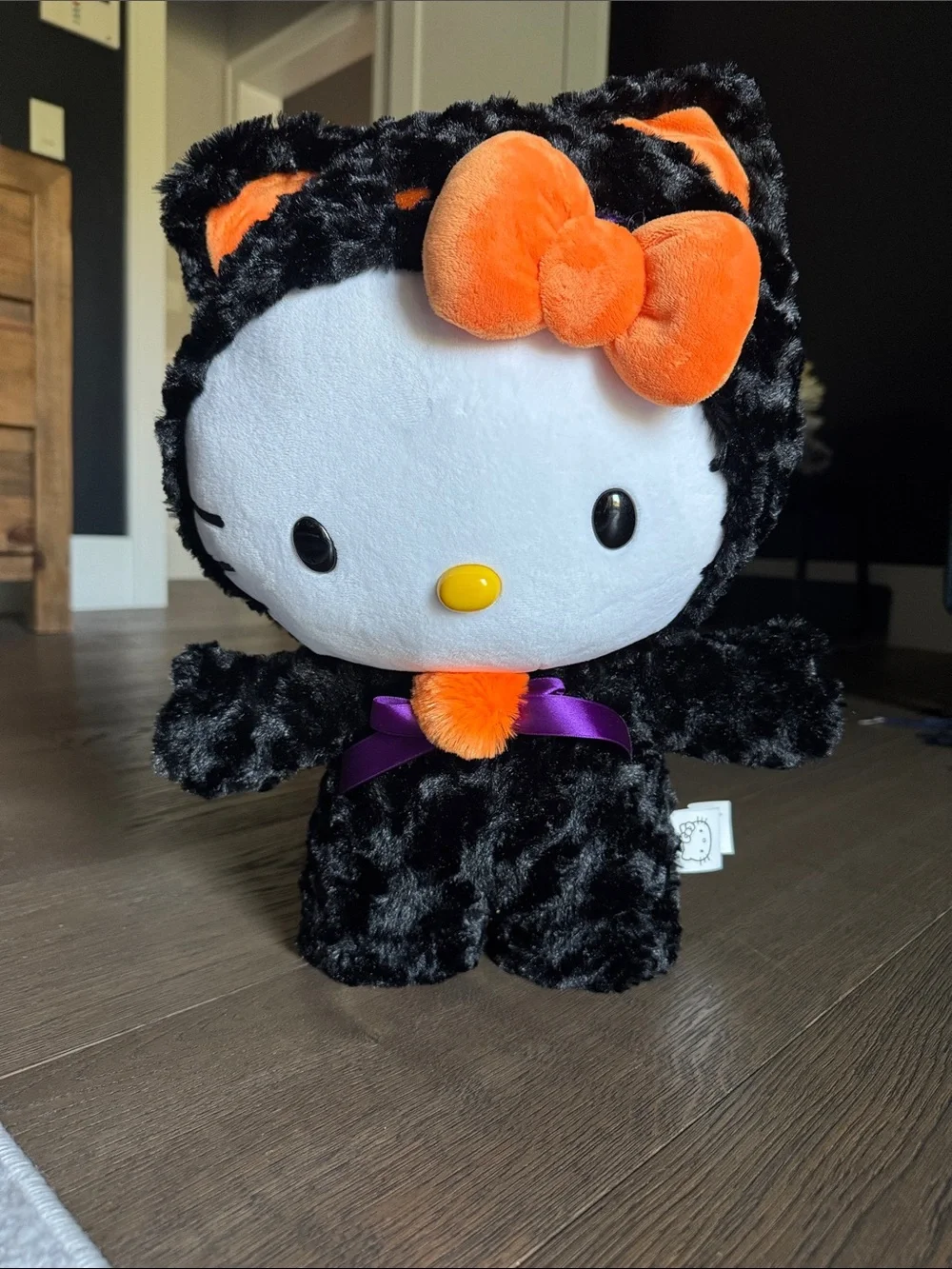 Sanrio Hello Kitty Black & Orange Plush Costume with Purple Bow